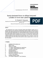 Inertia dominated forces on oblique horizontal
cylinders in waves near a plane boundary