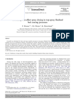 Modelling side-effect spray drying in top-spray fluidised bed coating processes