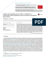 Analysis and Modeling the Size Effect on Vibration of Functionally Graded Nanobeams