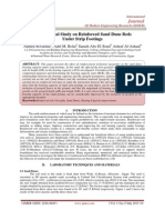 Experimental Study on Reinforced Sand Dune Beds Under Strip Footings