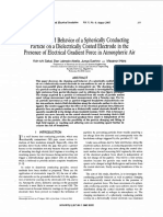 Charging and Behavior of A Spherically Conducting Particle On A Dielectrically Coated Electrode in The Presence of Electrical Gradient Force in Atmospheric Air