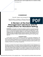 A Review of The Earnings Management Literature and Its Implications For Standard Setting