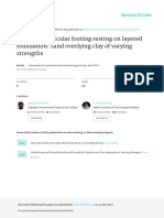 Behaviour of Circular Footing Resting on Layered Foundation Sand Overlying Clay of Varying Strengths