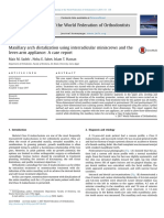 Maxillary arch distalization using interradicular miniscrews and the lever-arm appliance.pdf