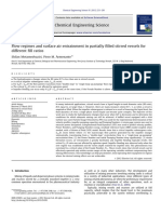 Flow Regimes and Surface Air Entrainment in Partially Filled Stirred Vessels