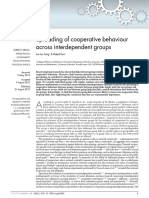 Spreading of Cooperative Behaviour Across Interdependent Groups