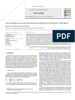 CFD Modeling of Pressure Drop and Drag Coefficient in Fixed Beds: Wall Effects