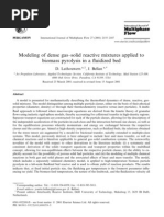 Modeling of dense gas=solid ractive mixture applied to biomass pyrolysis in a fluidized bed