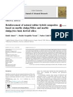 Reinforcement of NR Hybrid Composites with Marble Sludge and Rice Husk