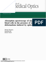 Absorption Spectroscopy of Single Red Blood Cells in The Presence of Mechanical Deformations Induced by Optical Traps