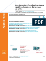 Polarization Dependent Focusing Lens by Use of Quantized Pancharatnam-Berry Phase Diffractive Optics