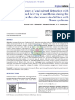 Effectiveness of Audiovisual Distraction With Computerized Delivery of Anesthesia During The Placement of Stainless Steel Crowns in Children With Down Syndrome