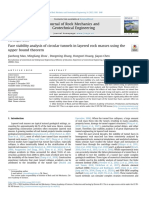 Face stability analysis of circular tunnels in layered rock masses