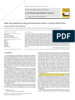 Shark Skin Inspired Low-Drag Microstructured Surfaces in Closed Channel Flow