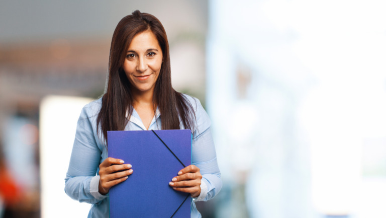 Woman Smiling With Folder | PDF