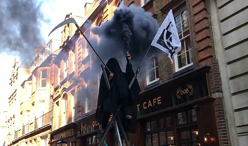 Eight Arrests As Fake Crude Oil Thrown And 'Grim Reaper' Appears At ...